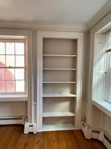 a view of walk in closet with empty racks