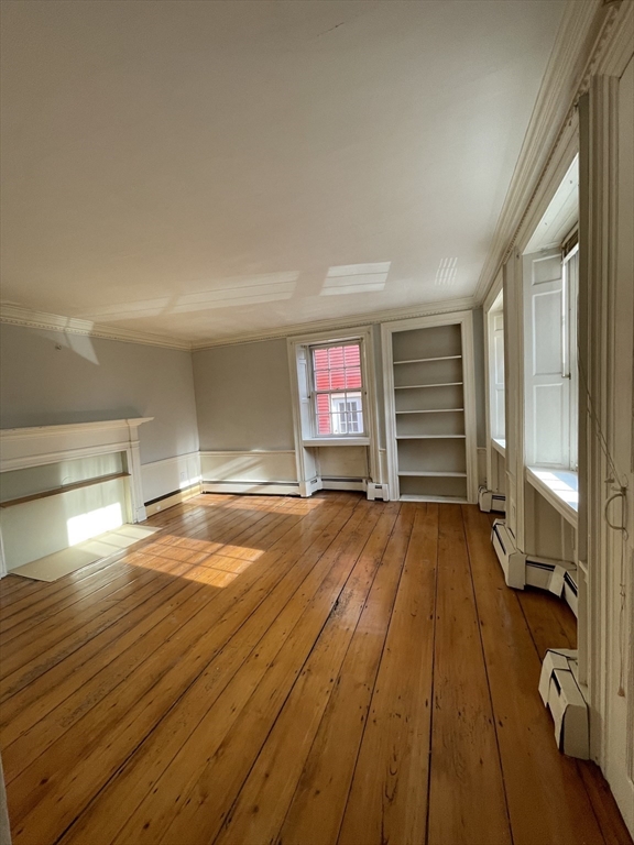 37 Turner Street, Unit 2 Salem, MA 01970 - Photo 7 of 9 a view of a room with wooden floor and chair