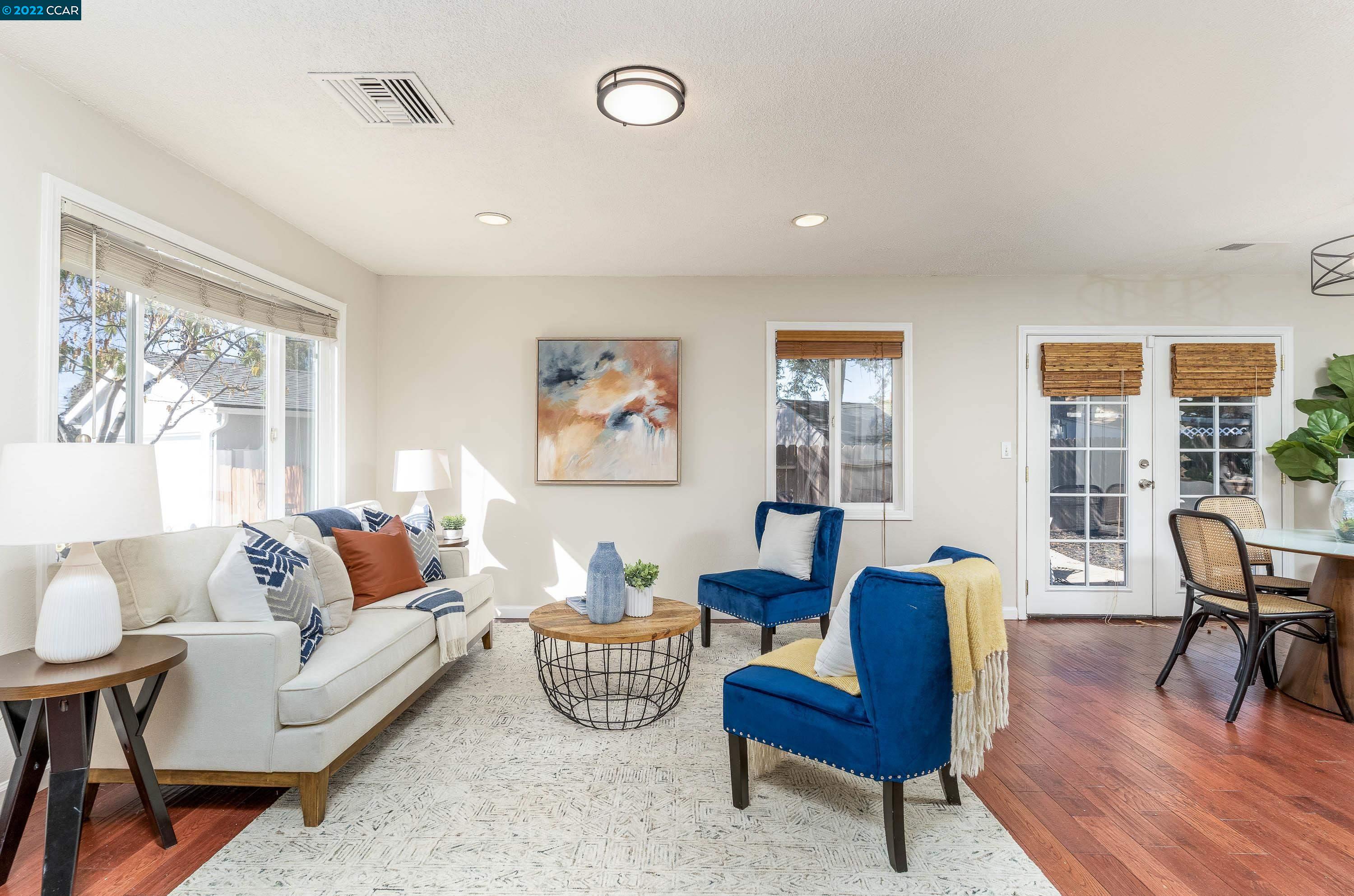 2753 Ruff Court Pinole, CA 94564 - Photo 1 of 1 a living room with furniture and a wooden floor