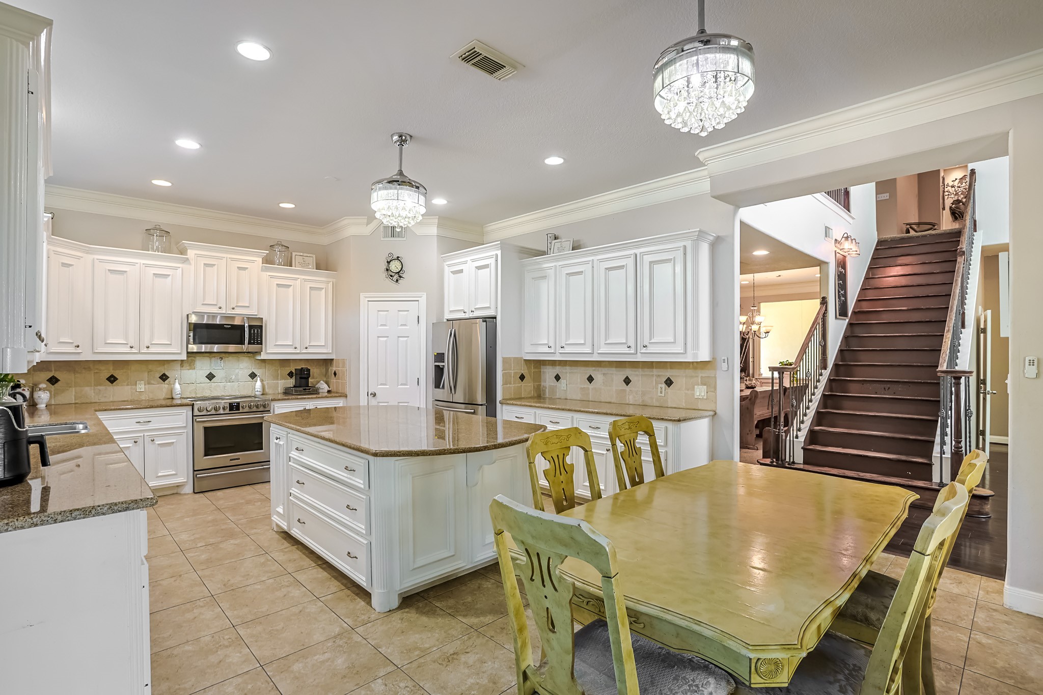 30119 West Geneva Drive Spring, TX 77386 - Photo 11 of 35 Gourmet kitchen with an expansive island, stainless-steel appliances, and abundant cabinetry for elegant everyday living.
