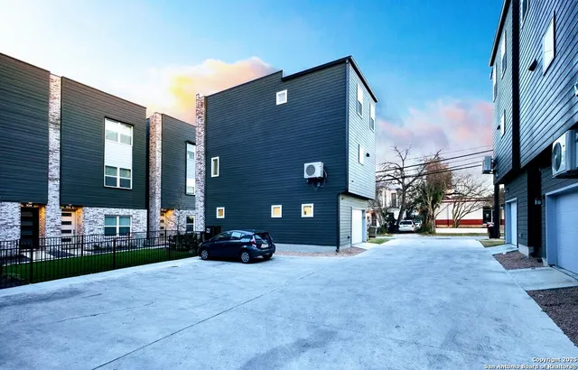 a view of a brick building with many windows