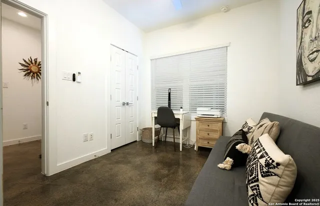 a view of a livingroom with furniture and windows