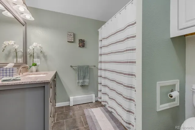 a view of walk in closet and bedroom