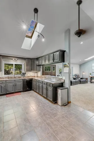 a kitchen with a stove top oven and cabinets