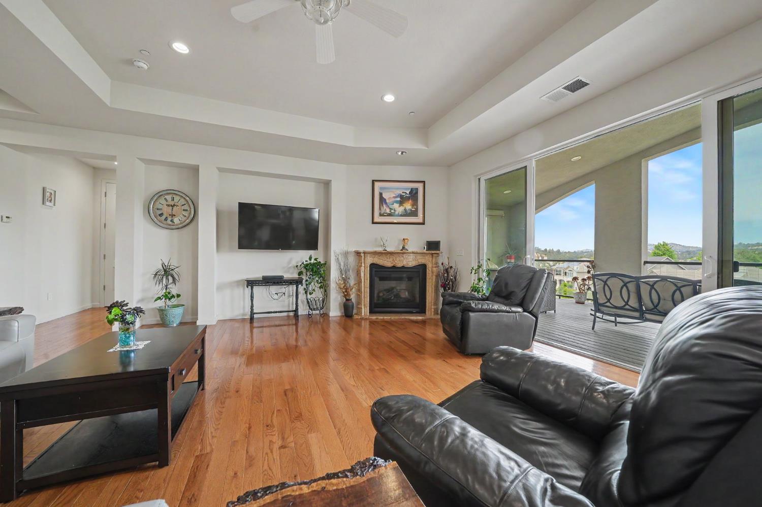 6066 Bluff View Road Copperopolis, CA 95228 - Photo 24 of 96 a living room with furniture fireplace and a flat screen tv