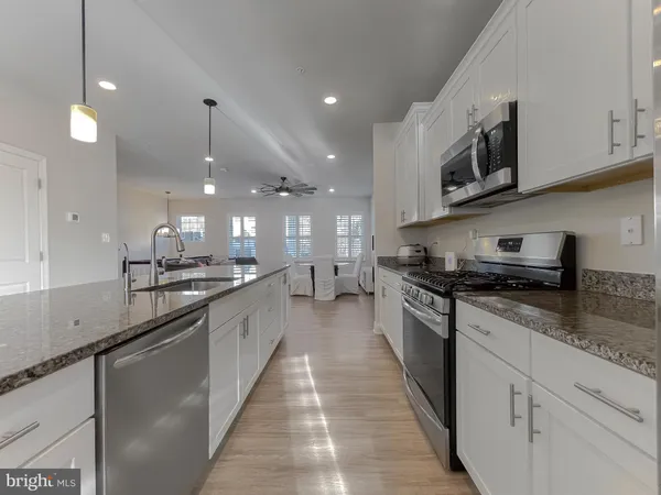 a large kitchen with stainless steel appliances