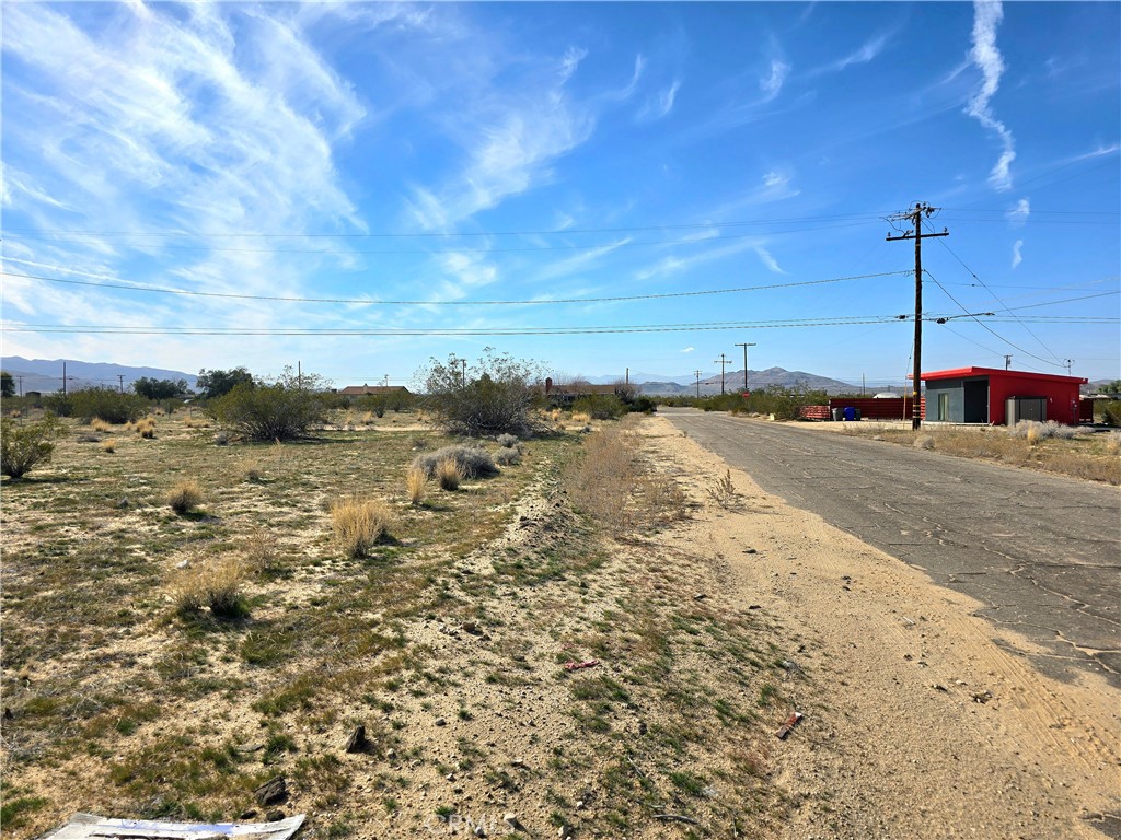 4966 1st Street East Joshua Tree, CA 92252 - Photo 3 of 3 a view of a beach with a yard