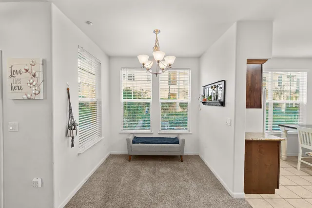 a bathroom with a granite countertop sink a toilet and a mirror