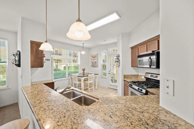 a view of storage and utility room with washer and dryer