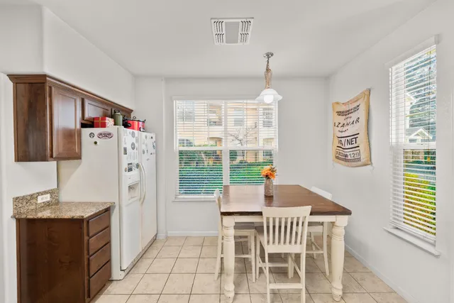 an aerial view of a houses with yard