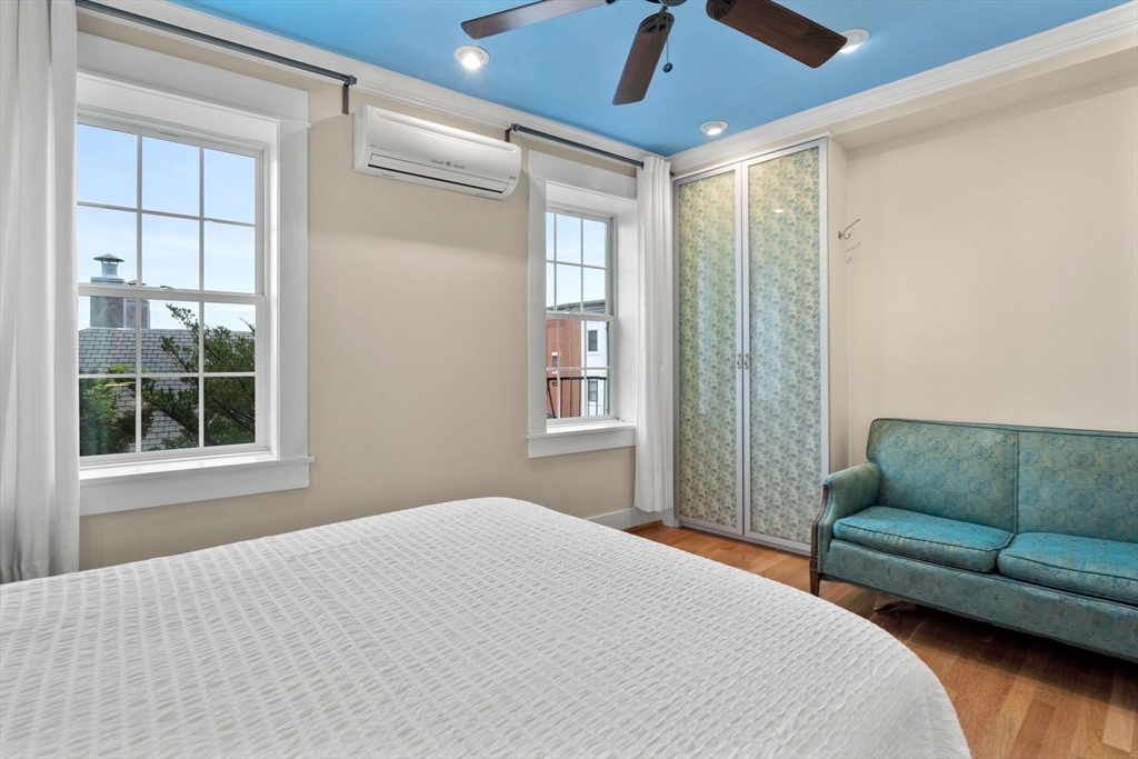 6 North Hudson Street, Unit 1 Boston, MA 02113 - Photo 13 of 22 a bedroom with furniture and a window