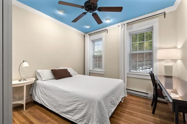 a bedroom with a bed and a table