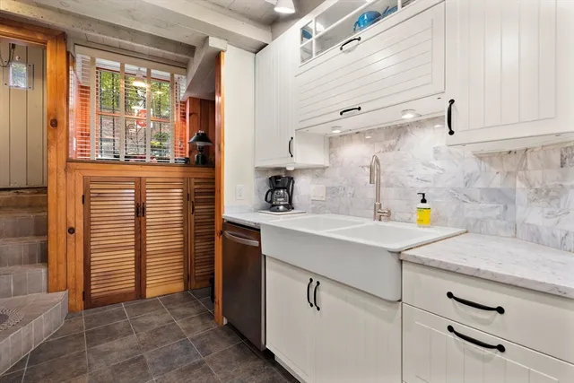a kitchen with a sink and cabinets
