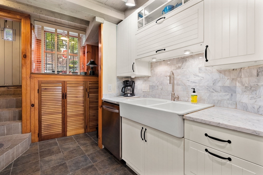 6 North Hudson Street, Unit 1 Boston, MA 02113 - Photo 3 of 22 a kitchen with a sink and cabinets