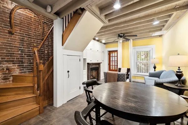 a view of a livingroom with furniture and a fireplace