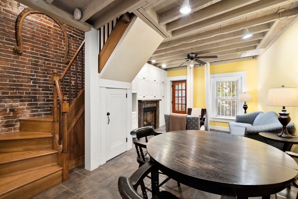 6 North Hudson Street, Unit 1 Boston, MA 02113 - Photo 6 of 22 a view of a livingroom with furniture and a fireplace