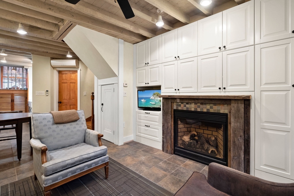 6 North Hudson Street, Unit 1 Boston, MA 02113 - Photo 8 of 22 a living room with furniture and a fireplace