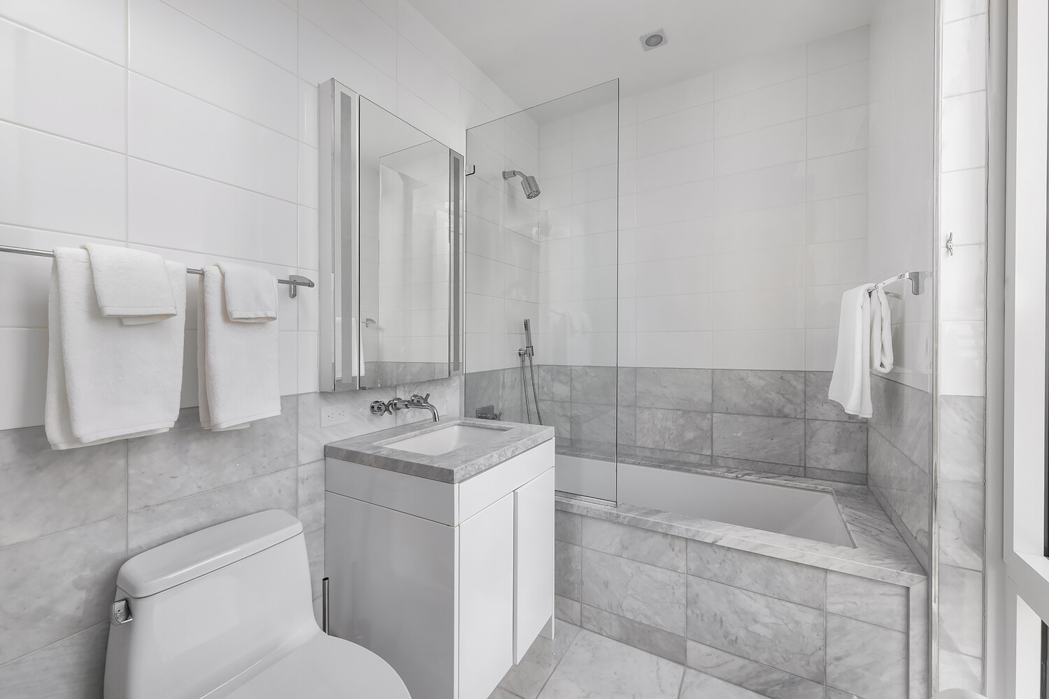 1355 1st Avenue, Unit 22 Manhattan, NY 10021 - Photo 10 of 16 a bathroom with a sink toilet and shower