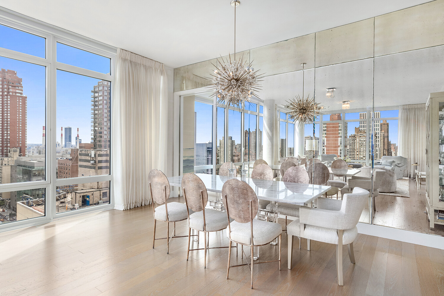 1355 1st Avenue, Unit 22 Manhattan, NY 10021 - Photo 3 of 16 a dining room with furniture water view and large windows