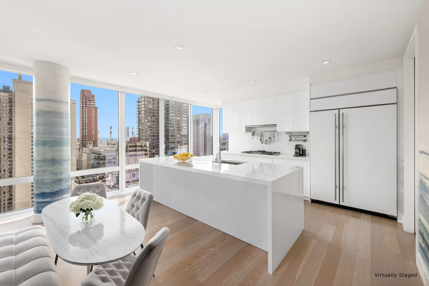 1355 1st Avenue, Unit 22 Manhattan, NY 10021 - Photo 4 of 16 a living room with stainless steel appliances furniture a large window and a wooden floor