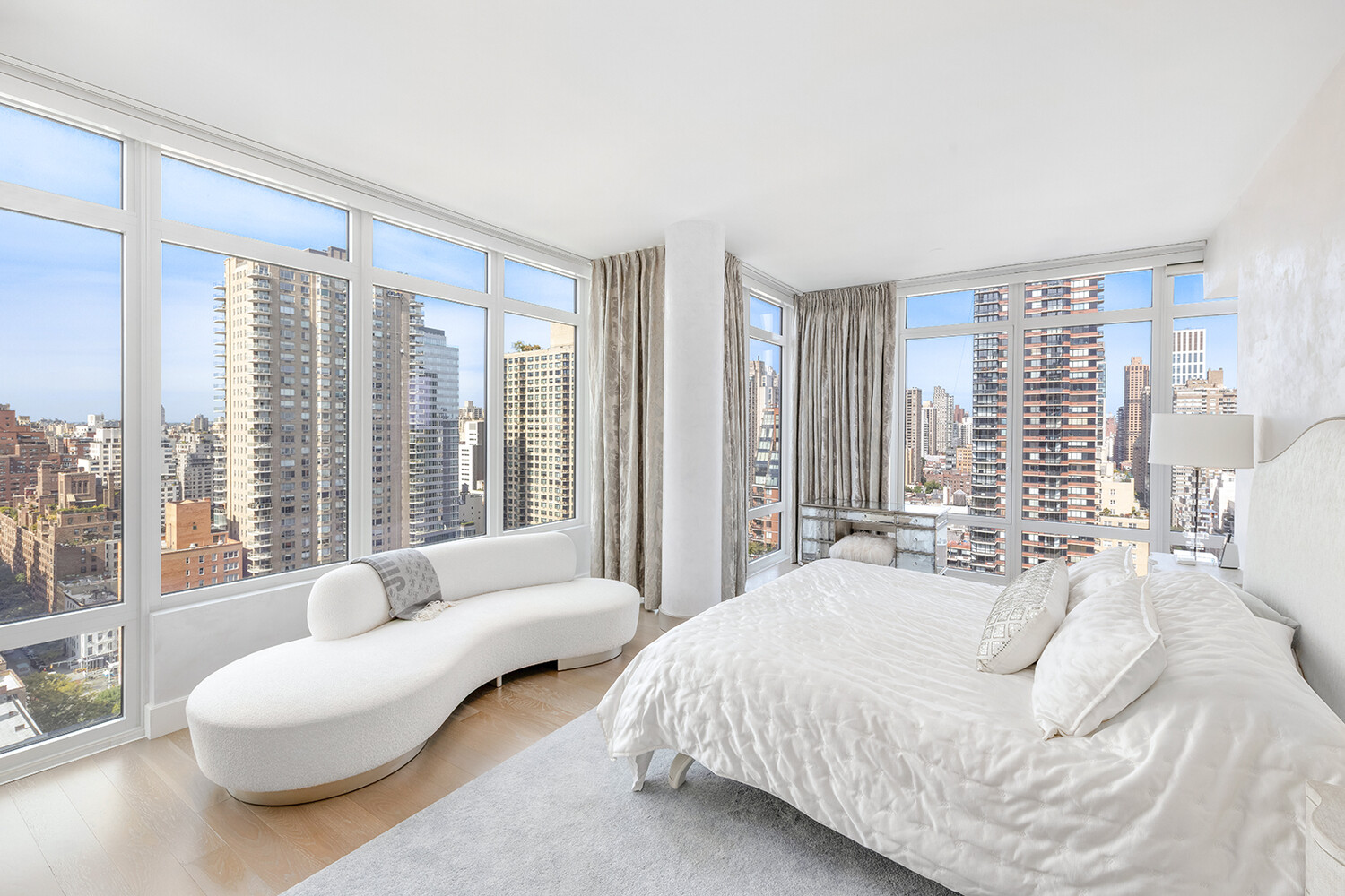 1355 1st Avenue, Unit 22 Manhattan, NY 10021 - Photo 6 of 16 a spacious bedroom with a bed and glass window