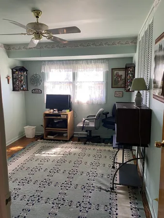 a bathroom with a shower curtain and a sink