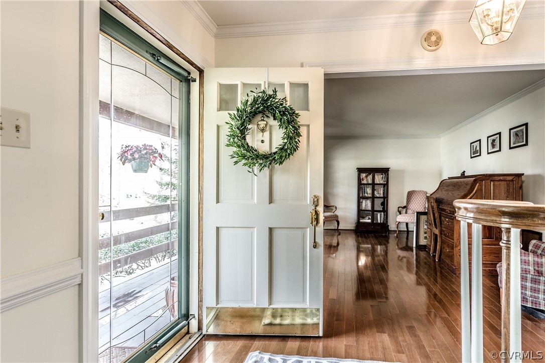 13625 Queensgate Road Midlothian, VA 23114 - Photo 1 of 35 a view of a hallway with wooden floor and windows