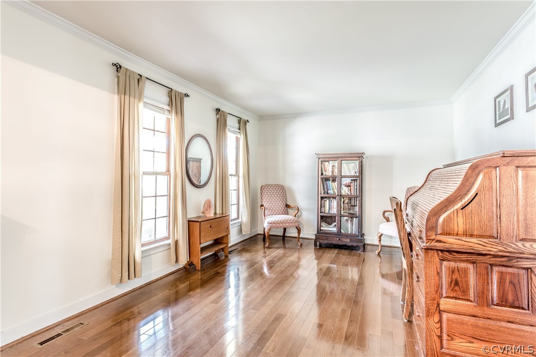 13625 Queensgate Road Midlothian, VA 23114 - Photo 12 of 35 a living room with furniture a wooden floor and a window