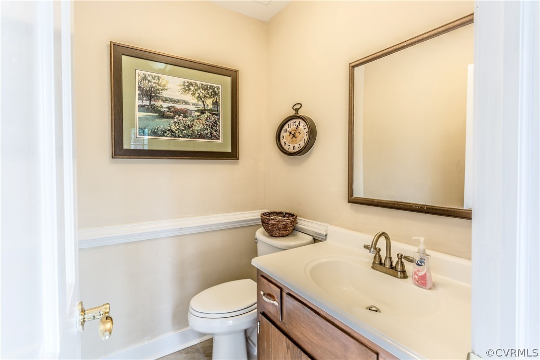13625 Queensgate Road Midlothian, VA 23114 - Photo 14 of 35 a bathroom with a sink mirror vanity and toilet