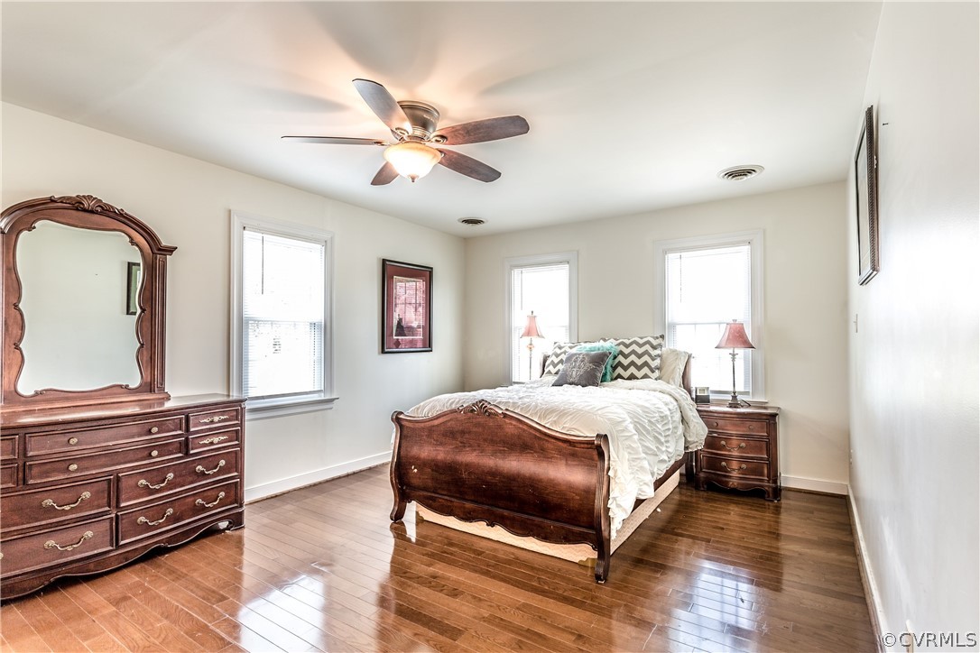 13625 Queensgate Road Midlothian, VA 23114 - Photo 16 of 35 a bedroom with a bed and wooden floor