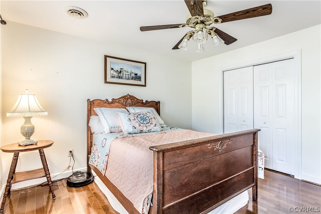 13625 Queensgate Road Midlothian, VA 23114 - Photo 22 of 35 a bedroom with a bed and a chandelier fan