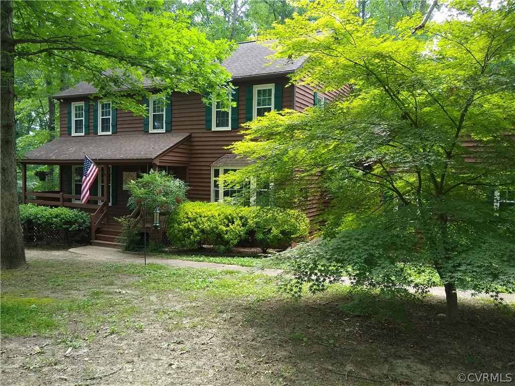 13625 Queensgate Road Midlothian, VA 23114 - Photo 34 of 35 a view of a house with a yard and potted plants