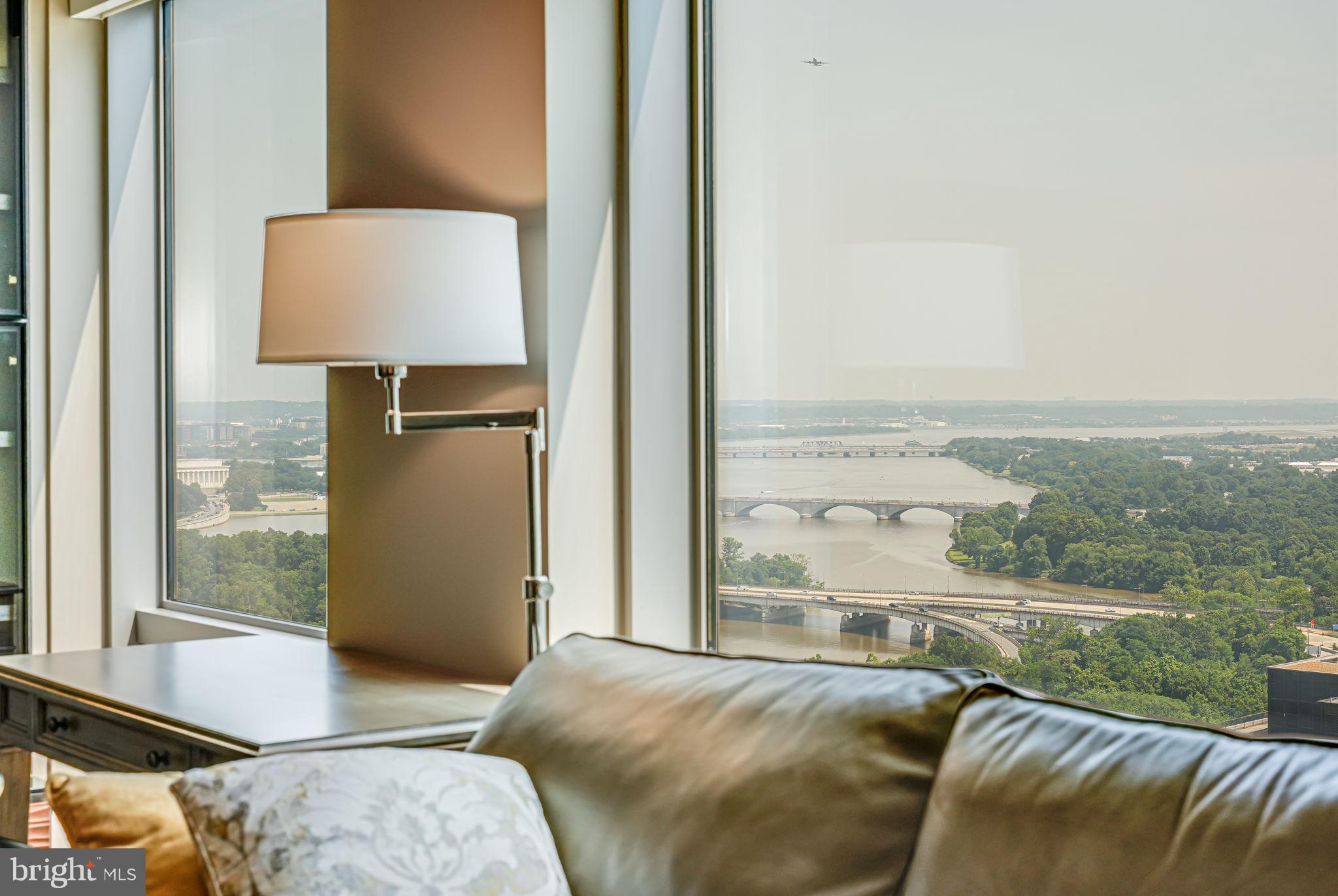 1111 19th Street North, Unit 2703 Arlington, VA 22209 - Photo 17 of 52 a bedroom with furniture and a window