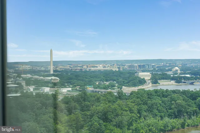 a view of a city with lawn chairs