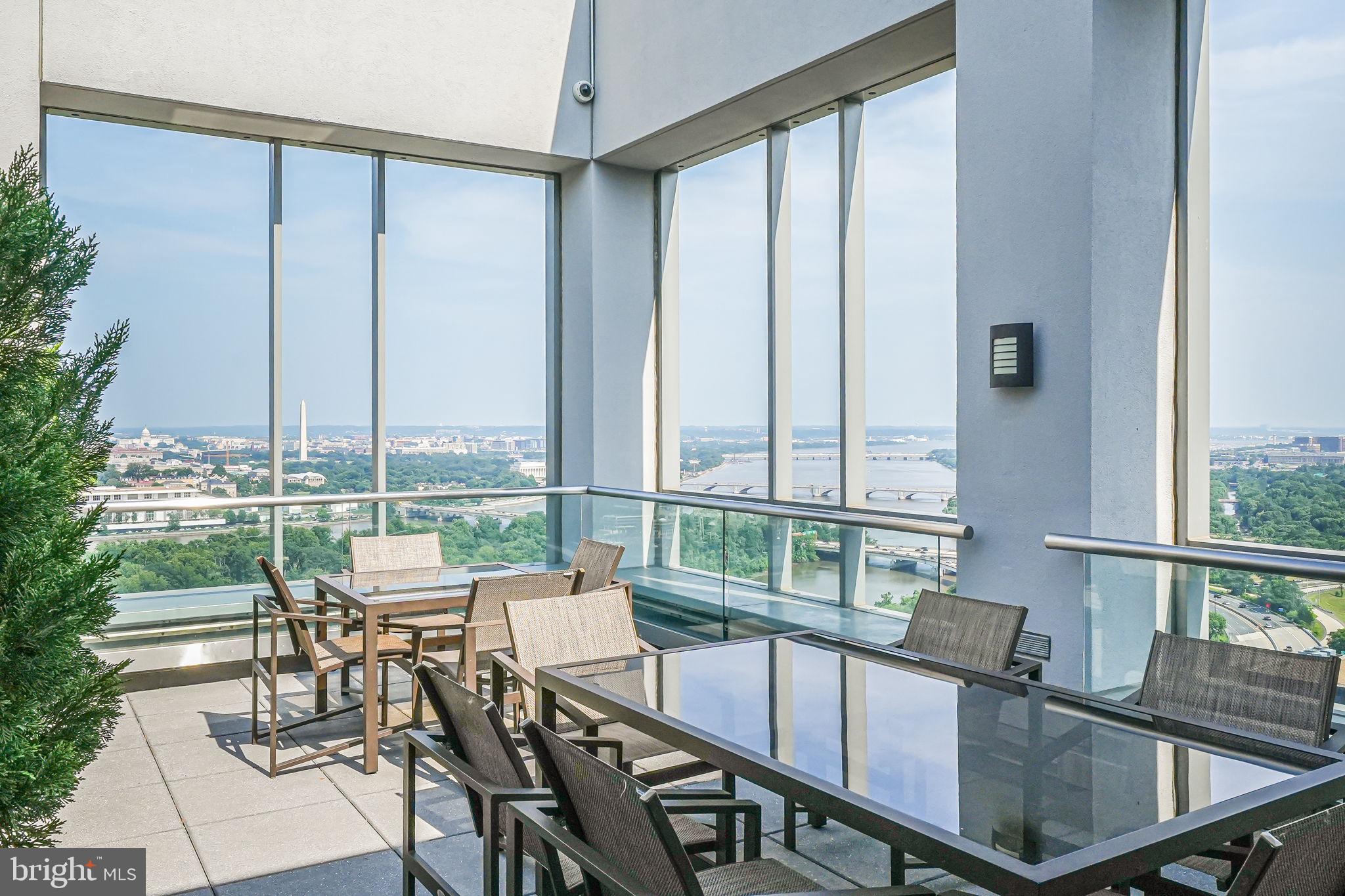 1111 19th Street North, Unit 2703 Arlington, VA 22209 - Photo 2 of 52 a view of a dining room with furniture window and outside view