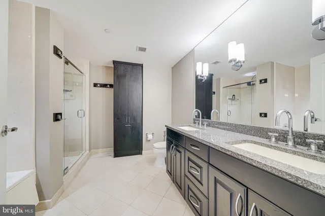 a bathroom with a shower and a bath tub