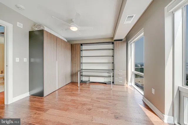 a bedroom with a bed and a mirror