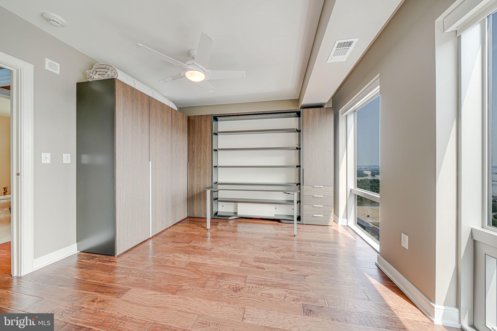 1111 19th Street North, Unit 2703 Arlington, VA 22209 - Photo 40 of 52 a view of an empty room with a window