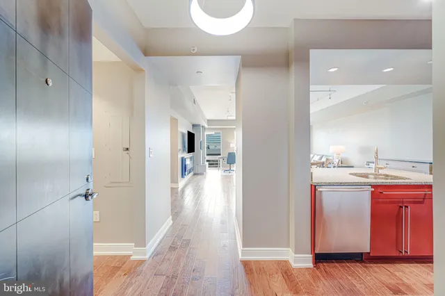 a view of bathroom with bathtub and wooden floor