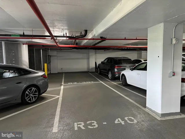 a building outdoor space with patio furniture and potted plants