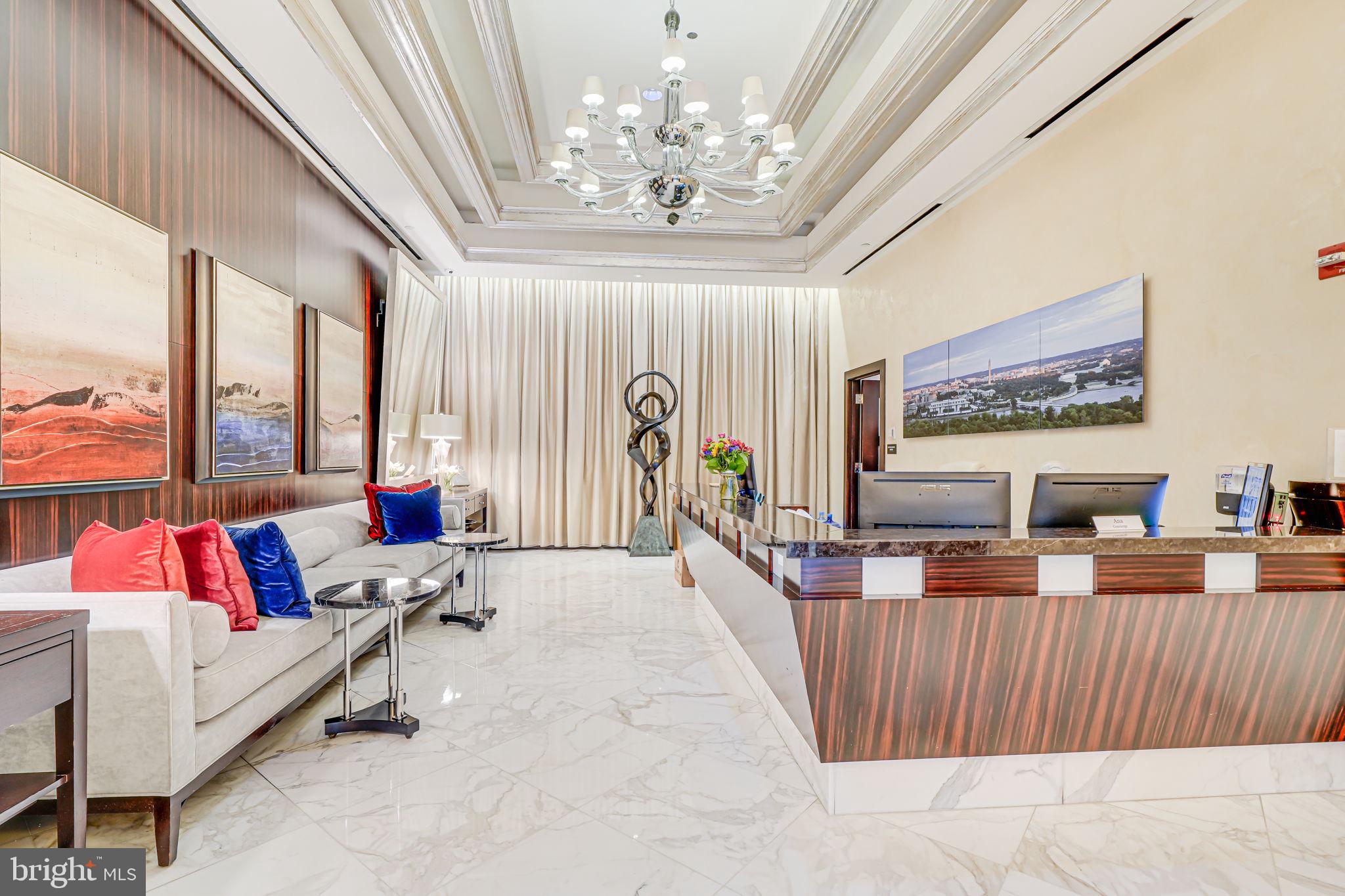 1111 19th Street North, Unit 2703 Arlington, VA 22209 - Photo 49 of 52 a living room with furniture and a chandelier