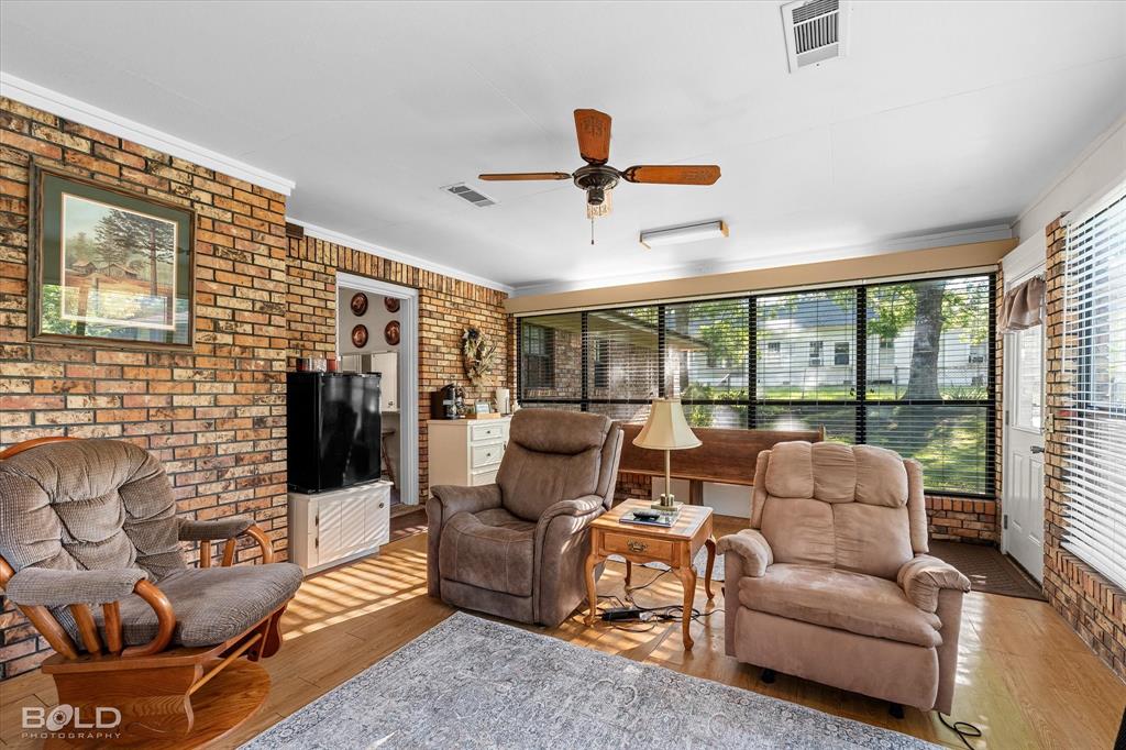 202 Butler Street Springhill, LA 71075 - Photo 25 of 38 a living room with furniture and a ceiling fan