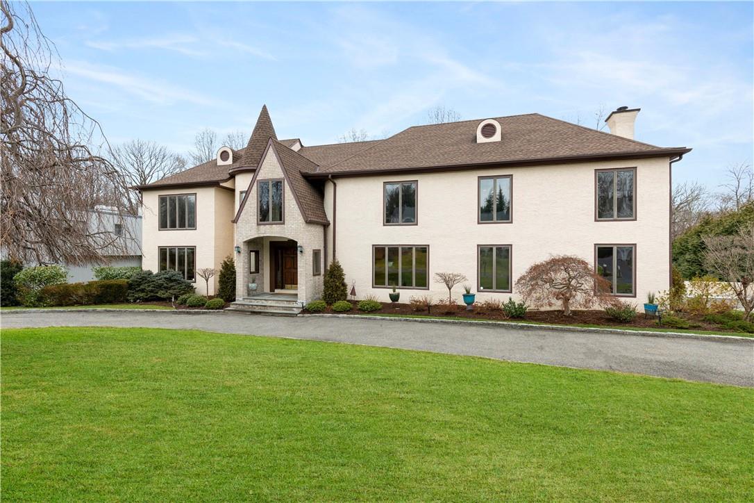 15 Marbourne Drive Mamaroneck, NY 10543 - Photo 1 of 1 a front view of a house with a garden