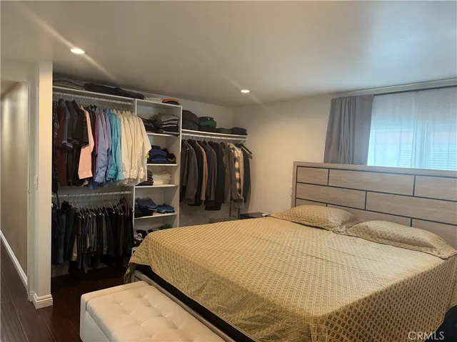 a bedroom with a bed and a closet