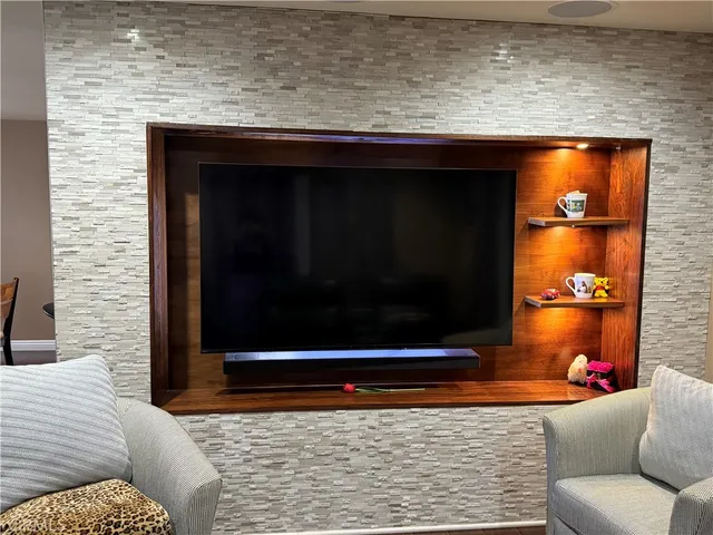 a living room with a couch and a fireplace