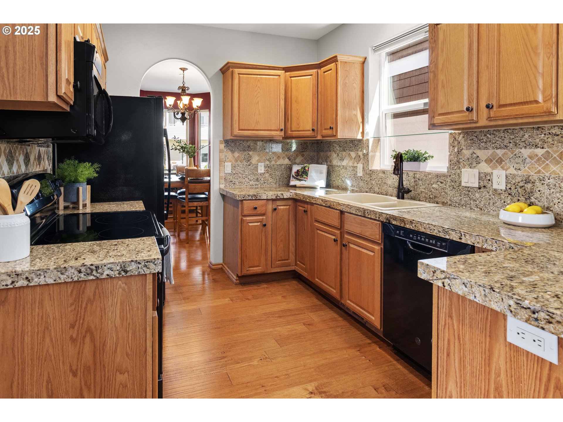 260 Round House Road Astoria, OR 97103 - Photo 12 of 37 a kitchen with stainless steel appliances granite countertop a sink stove and refrigerator
