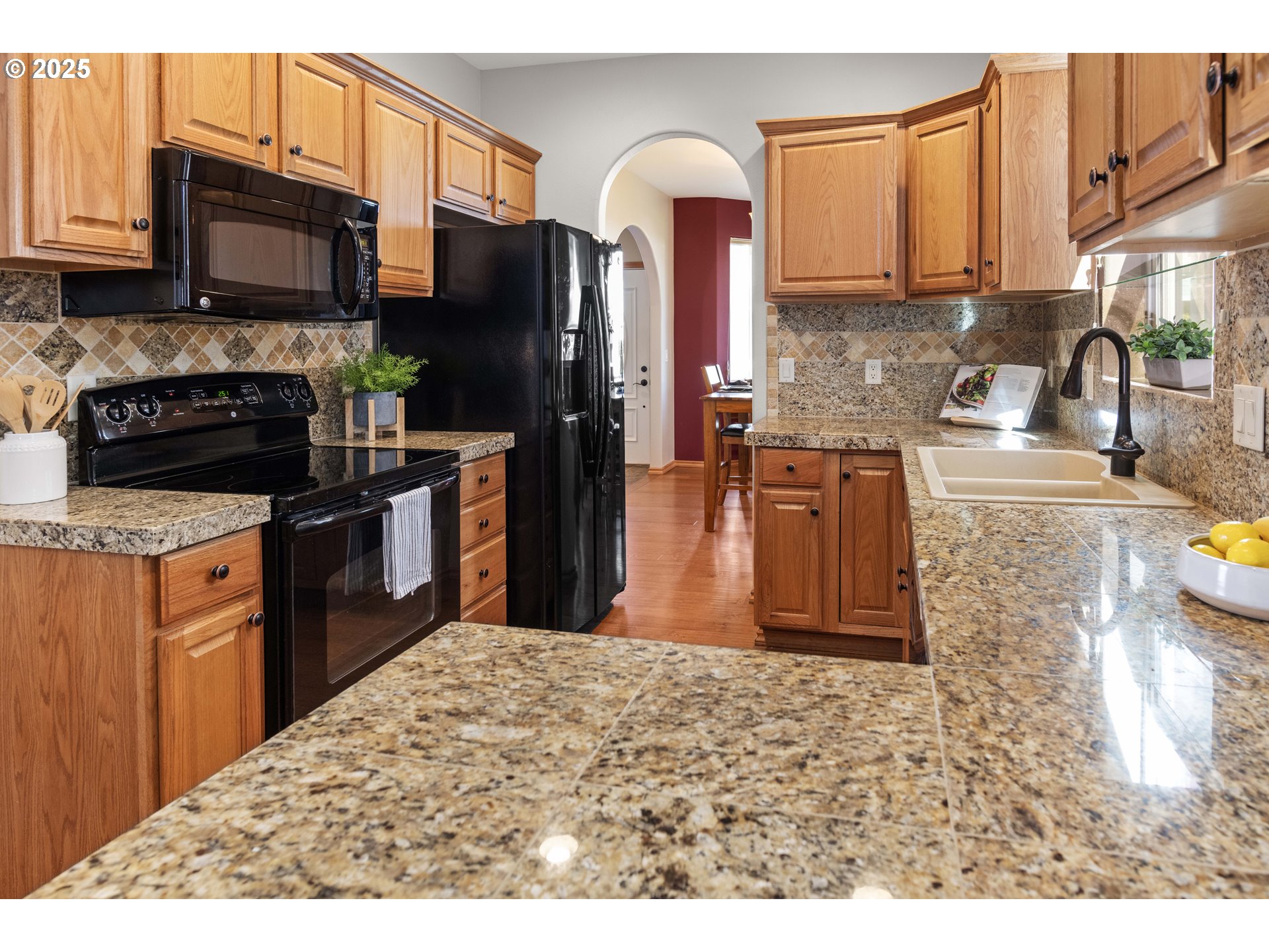 260 Round House Road Astoria, OR 97103 - Photo 13 of 37 a kitchen with stainless steel appliances granite countertop a refrigerator a stove top oven a sink and dishwasher