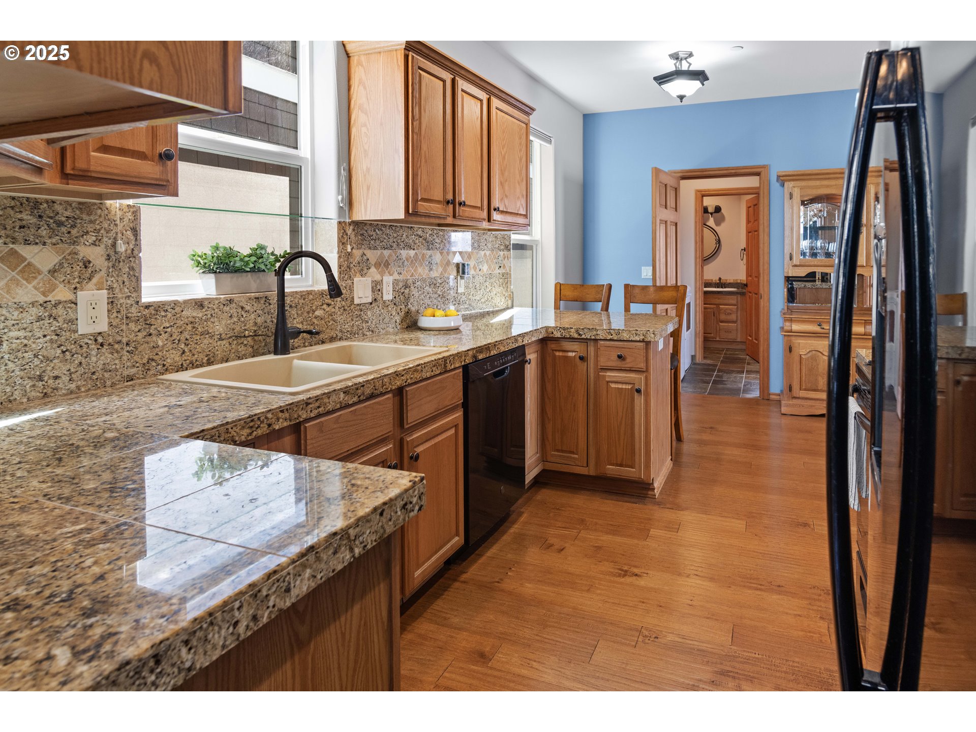 260 Round House Road Astoria, OR 97103 - Photo 15 of 37 a kitchen with stainless steel appliances granite countertop a sink stove and refrigerator