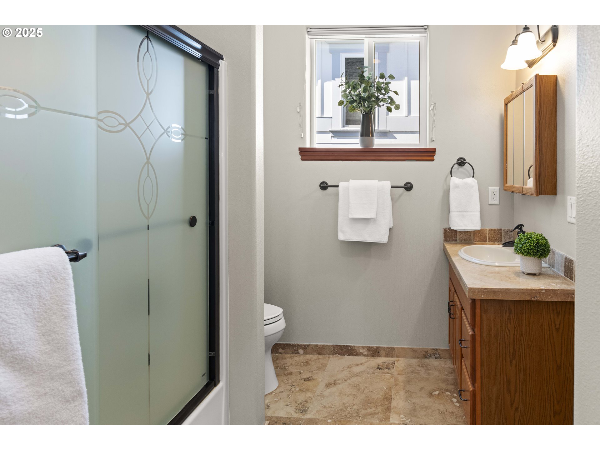 260 Round House Road Astoria, OR 97103 - Photo 29 of 37 a bathroom with a granite countertop sink a toilet and shower