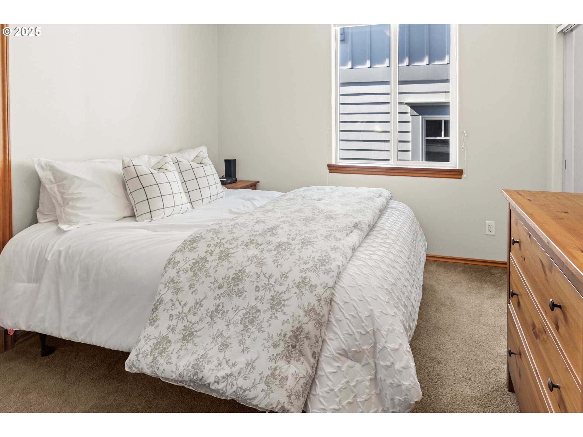 260 Round House Road Astoria, OR 97103 - Photo 31 of 37 a bedroom with a bed and a night stand